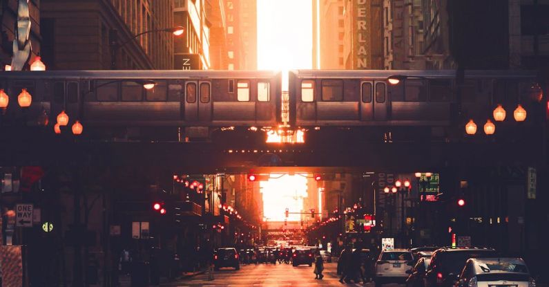 Community Centers - Urban city district with modern high rise architecture and elevated railway in early evening