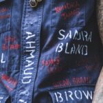 Community Policing - Unrecognizable tattooed guy supporting anti racism movement