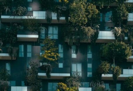 Urban Greenery - Modern residential building facade decorated with green plants