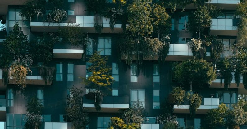 Urban Greenery - Modern residential building facade decorated with green plants