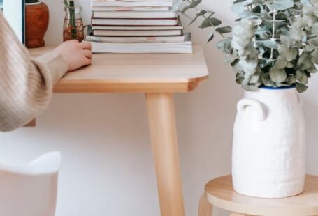 Mixed-Use Developments - Anonymous woman working on laptop in room