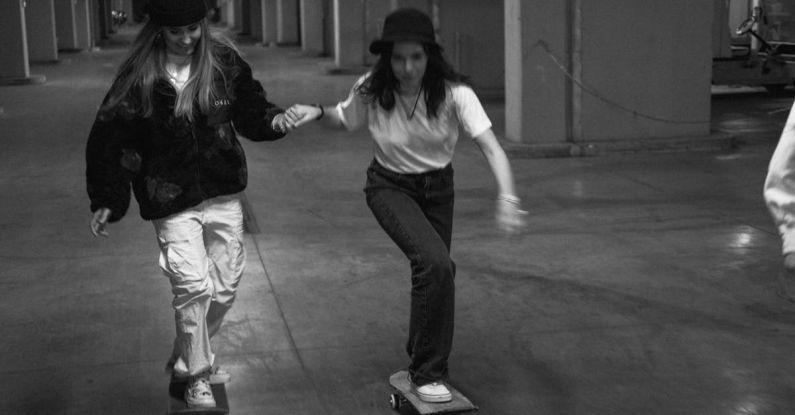 Parks And Recreational Areas - Grayscale Photo of Women Riding Skateboard