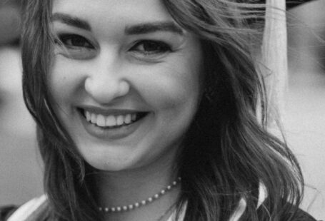 School Quality - A black and white photo of a woman in a graduation gown