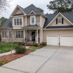 Suburban Developments - White and Brown Wooden House Near Bare Trees Under White Sky