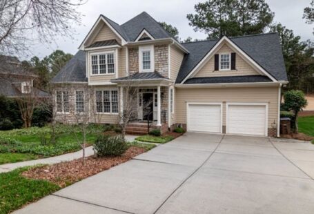 Suburban Developments - White and Brown Wooden House Near Bare Trees Under White Sky