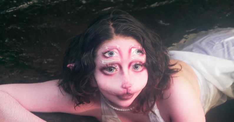 Emerging Markets - A woman in a white dress laying in the water