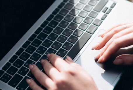 Technology Disruption - A person typing on a laptop computer