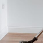 Property Maintenance - Modern vacuum cleaner washing floor in flat