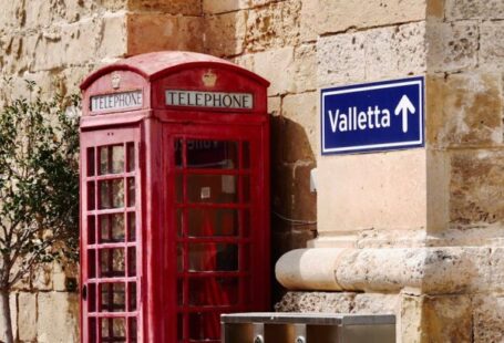 Recycling Programs - A red telephone booth next to a red telephone box